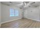 Inviting living room with new floors, a ceiling fan, and a bright window illuminating the neutral interior at 141 Larson Dr, Summerville, SC 29485