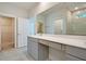 Bright bathroom with a vanity, large mirror, and walk-in closet at 1423 Clay Field Trl, Summerville, SC 29485