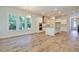 Open-concept kitchen with white cabinets, stainless appliances, and a large island at 1423 Clay Field Trl, Summerville, SC 29485