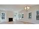 Bright living room featuring a fireplace, many windows, and wood-style flooring at 1423 Clay Field Trl, Summerville, SC 29485