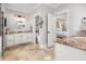 Bright bathroom featuring double vanity, tile floors, and white cabinets, with an attached toilet room at 1543 Wando Landing St, Charleston, SC 29492