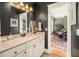 Bathroom featuring black walls, light countertops, modern lighting, with a drum set in the background at 1543 Wando Landing St, Charleston, SC 29492