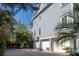 View of home's side showcasing the garage, basketball hoop, and access to outdoor space at 1543 Wando Landing St, Charleston, SC 29492