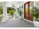 Cozy front porch with seating, ceiling fan, and a clear view of the outdoors at 1543 Wando Landing St, Charleston, SC 29492