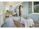 Inviting front porch with wicker furniture, ceiling fan, and charming decor at 1543 Wando Landing St, Charleston, SC 29492