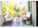 Inviting front porch with wicker furniture, and charming decor at 1543 Wando Landing St, Charleston, SC 29492