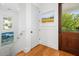 Bright foyer with hardwood floors, a view of the staircase and art at 1543 Wando Landing St, Charleston, SC 29492