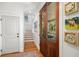Hallway featuring wooden floors, a staircase, and artwork on the walls at 1543 Wando Landing St, Charleston, SC 29492