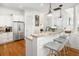 Kitchen island with granite countertops, stainless steel appliances, and bar stool seating at 1543 Wando Landing St, Charleston, SC 29492