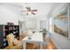 Bright office space with a white desk, floral chairs, and an abstract art piece at 1543 Wando Landing St, Charleston, SC 29492