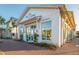 Charming exterior of a restaurant with large windows and well-maintained landscaping at 1543 Wando Landing St, Charleston, SC 29492