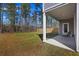 Cozy back porch and spacious backyard are perfect for relaxation and outdoor enjoyment, featuring a well-maintained lawn at 164 Wappoo Trace Ln, Summerville, SC 29486