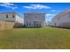Spacious fenced backyard offers ample space for outdoor activities and privacy between neighboring homes at 164 Wappoo Trace Ln, Summerville, SC 29486