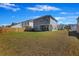 Wide view of backyard and exterior of the home, showcasing the fenced lawn and ample outdoor space at 164 Wappoo Trace Ln, Summerville, SC 29486