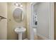Half bathroom with vanity sink and a view into the living room at 164 Wappoo Trace Ln, Summerville, SC 29486