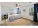 Bright bedroom with a ceiling fan, carpet, and windows with beautiful forest view at 164 Wappoo Trace Ln, Summerville, SC 29486