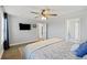 Bright bedroom with a ceiling fan, wood floors, and TV at 164 Wappoo Trace Ln, Summerville, SC 29486