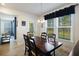 Dining room with a wood table, natural light and view into the living room at 164 Wappoo Trace Ln, Summerville, SC 29486