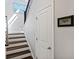 View of the staircase featuring hardwood steps, white walls and black railing at 164 Wappoo Trace Ln, Summerville, SC 29486
