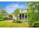 Charming home features a screened porch and brick patio overlooking a well-maintained lawn at 174 Revetment Ln, Mount Pleasant, SC 29464