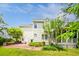 This home includes a brick patio area, a screened porch and a well-kept lawn at 174 Revetment Ln, Mount Pleasant, SC 29464