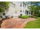Spacious brick patio with multiple access points to the house and lush green lawn at 174 Revetment Ln, Mount Pleasant, SC 29464