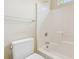 Bright bathroom featuring a tiled bathtub, toilet, and towel bar at 174 Revetment Ln, Mount Pleasant, SC 29464