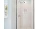 Tiled shower with built-in niche and glass door allowing ample light from window at 174 Revetment Ln, Mount Pleasant, SC 29464