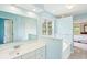 Bright, colorful bathroom with a large vanity and sinks adjacent to bathtub at 174 Revetment Ln, Mount Pleasant, SC 29464