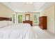 Large bedroom with natural light from multiple windows, paired dressers and a comfy king bed at 174 Revetment Ln, Mount Pleasant, SC 29464