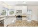 Bright eat-in kitchen featuring granite countertops, an island with seating, and stainless steel appliances at 174 Revetment Ln, Mount Pleasant, SC 29464