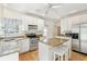 Bright eat-in kitchen featuring granite countertops, an island with seating, and stainless steel appliances at 174 Revetment Ln, Mount Pleasant, SC 29464