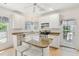 Bright eat-in kitchen featuring granite countertops, an island with seating, and stainless steel appliances at 174 Revetment Ln, Mount Pleasant, SC 29464