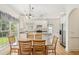 Open kitchen with a glass top dining table, stainless steel appliances, and ample counter space at 174 Revetment Ln, Mount Pleasant, SC 29464
