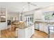 Bright eat-in kitchen with granite countertops, an island with seating, and stainless steel appliances at 174 Revetment Ln, Mount Pleasant, SC 29464