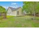 Backyard featuring a well-maintained lawn and mature trees for shade at 206 Barnwell St, Summerville, SC 29483