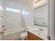 Bright bathroom featuring a bathtub/shower combo and single sink vanity at 206 Barnwell St, Summerville, SC 29483