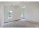Bright, carpeted bedroom with vaulted ceilings, ceiling fan and natural light from dual windows at 206 Barnwell St, Summerville, SC 29483