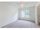 Bright, carpeted bedroom with a ceiling fan and a large window overlooking the yard at 206 Barnwell St, Summerville, SC 29483