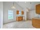 Bright eat-in kitchen with oak cabinets, tiled floors, white appliances and two large windows at 206 Barnwell St, Summerville, SC 29483