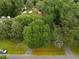Lush trees surround the home, providing ample shade and privacy on the lot in this aerial view at 2177 Gulf Dr, Mount Pleasant, SC 29464
