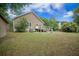 Backyard featuring a well-maintained lawn and the back of the home at 2177 Gulf Dr, Mount Pleasant, SC 29464