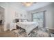 Bedroom features a ceiling fan, large window with curtains, hardwood floors, and neutral colored walls at 2177 Gulf Dr, Mount Pleasant, SC 29464