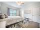 Bright bedroom with ceiling fan, hardwood floors, large window with curtains, and a rug at 2177 Gulf Dr, Mount Pleasant, SC 29464