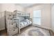 Comfortable bedroom featuring a well-lit bunk bed with storage and stylish rug at 2177 Gulf Dr, Mount Pleasant, SC 29464