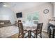 The dining area is naturally lit with a view of the fireplace and living room at 2177 Gulf Dr, Mount Pleasant, SC 29464