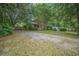 View of the home from the driveway shows attractive curb appeal with mature landscaping at 2177 Gulf Dr, Mount Pleasant, SC 29464