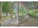 Spacious covered front porch, perfect for relaxing and enjoying the view at 2177 Gulf Dr, Mount Pleasant, SC 29464
