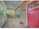 The front porch showcases a red front door and a blue ceiling with a ceiling fan at 2177 Gulf Dr, Mount Pleasant, SC 29464