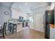 Bright kitchen with white cabinets, a breakfast bar, and stainless steel appliances at 2177 Gulf Dr, Mount Pleasant, SC 29464